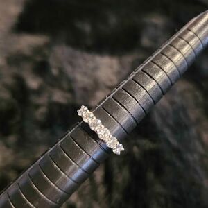 1.5CTW VVSD Moissanite wedding band in .925 sterling silver. Size 6